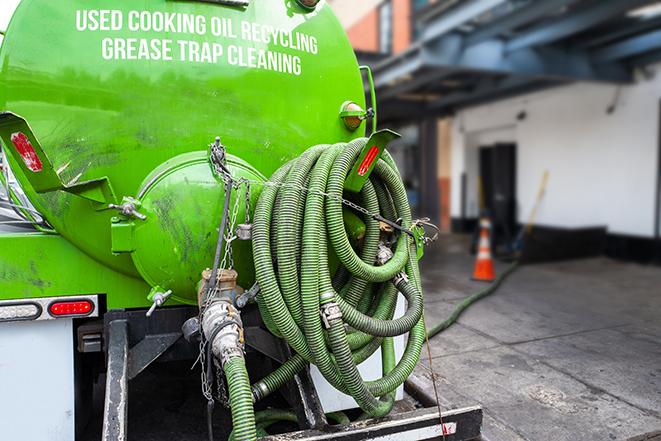 maintenance crew pumping grease trap at a fast food restaurant in Atwater CA